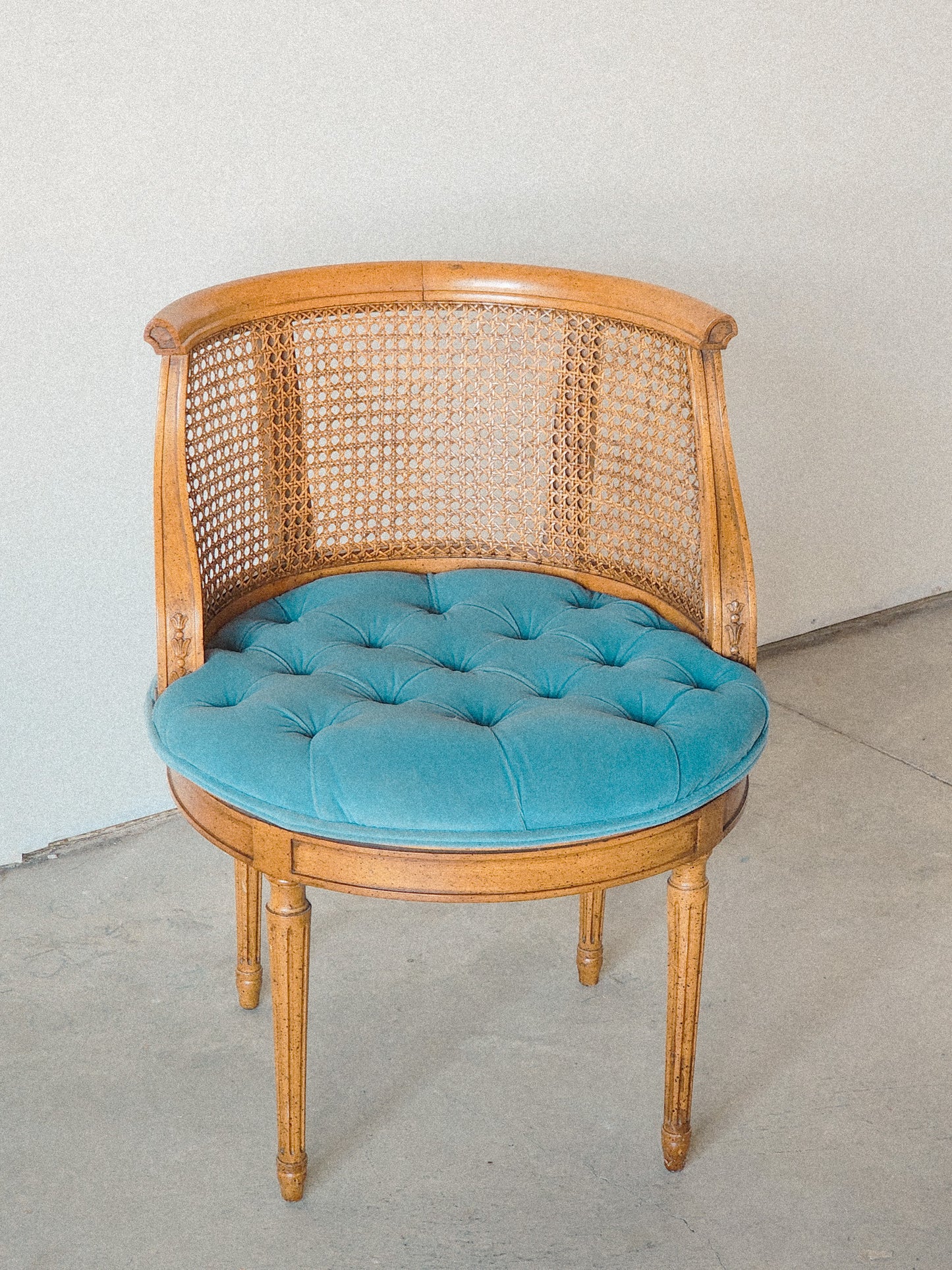 Vtg Swiveling Tufted Blue Caned Chair